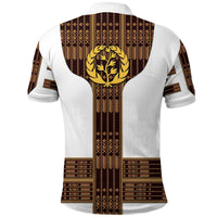 White polo shirt back with brown geometric stripes and large gold lion crest