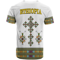 White adult T-shirt back shows 'ETHIOPIA' and large Ethiopian cross with diamond accents