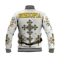 White baseball jacket back with ETHIOPIA print, diamond cross motifs, striped ribbed hem