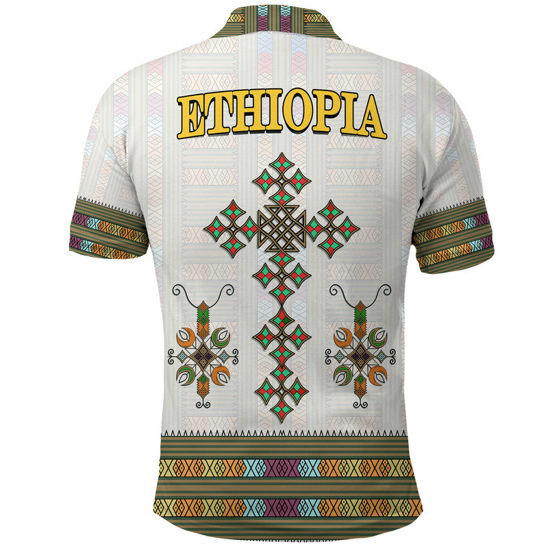 White polo shirt back with large ETHIOPIA text and diamond cross motifs, patterned hem