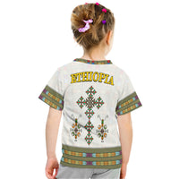 Kids white Ethiopia T-shirt back with gold “ETHIOPIA” text and diamond cross print