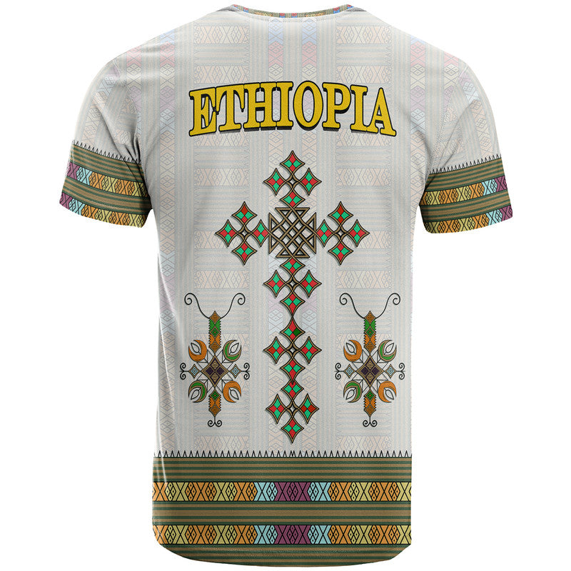 White Ethiopia T-shirt back with gold “ETHIOPIA” text and diamond cross ornament pattern