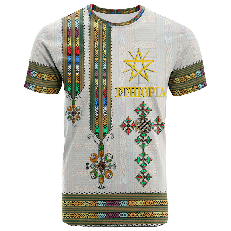 White Ethiopia T-shirt front with gold text, star emblem, and colorful tribal border stripes