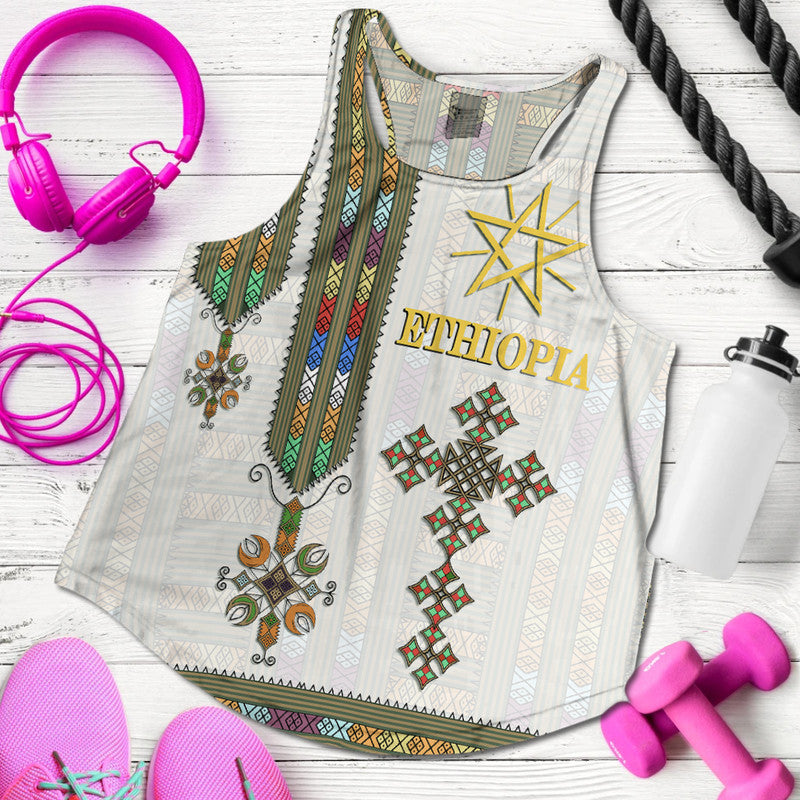 White racerback tank with Ethiopian print, gold star and “Ethiopia” on front