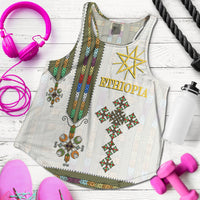 White racerback tank with Ethiopian print, gold star and “Ethiopia” on front