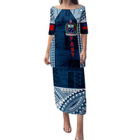Blue long puletasi dress with tapa pattern, square neckline, elbow sleeves