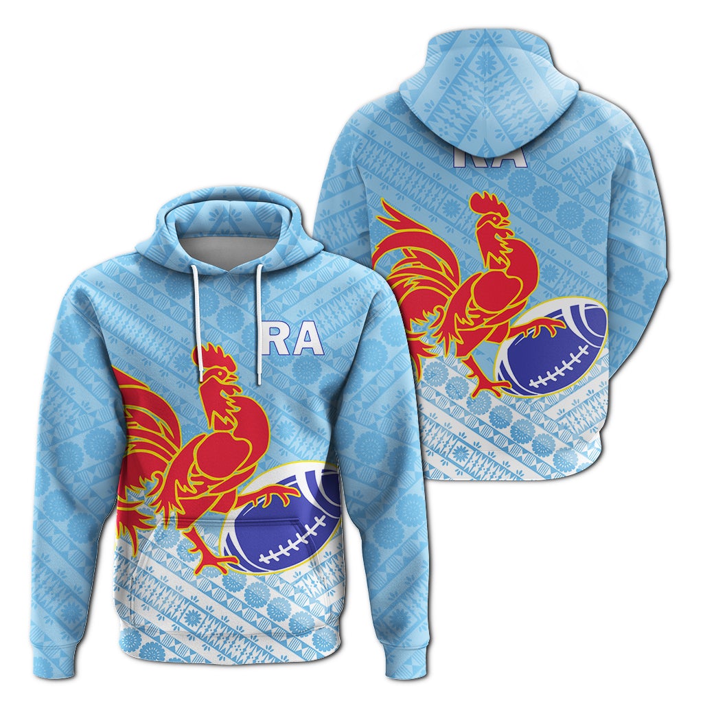 Blue pullover hoodie with tapa pattern, red rooster holding rugby ball; RA logo on chest.