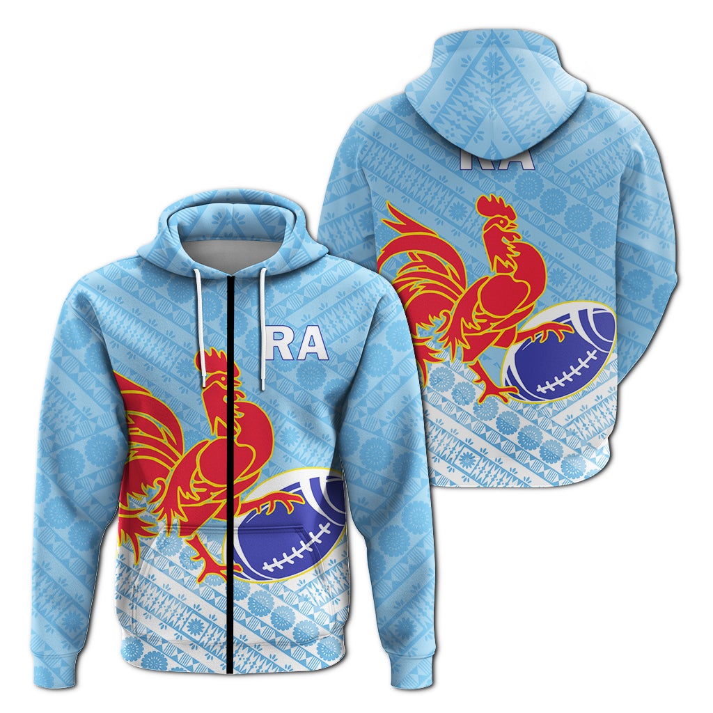 Blue zip hoodie with hood, tapa-style pattern, rooster crest and rugby ball graphic