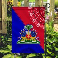 Haiti flag on stake, red-blue panels with central crest and wavy white motif