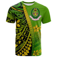 Green T-shirt with Polynesian geometric print and chest fire-emblem logo, short sleeves.