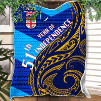 Blue Fiji independence day blanket outdoors with 2021 badge, shield crest, and gold curls