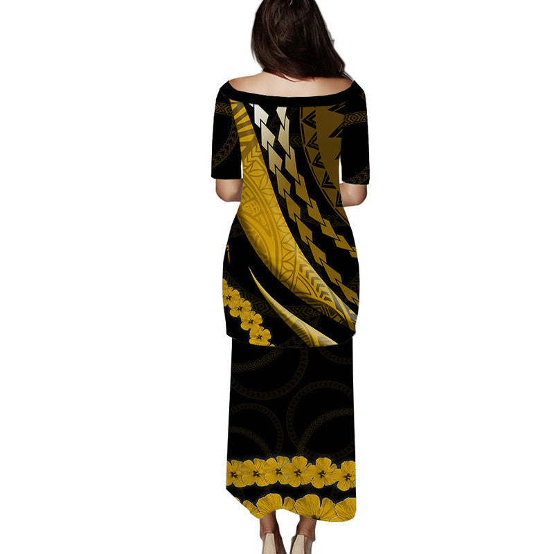 Long puletasi dress, black and gold patterned, back view, 3/4 sleeves, round neck