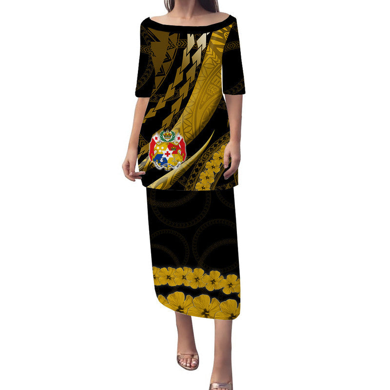 Long black and gold patterned dress with short sleeves and curved hem