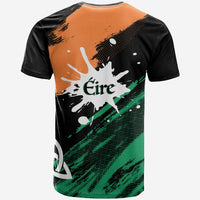 Back of multicolor grunge T-shirt with “Éire” text over Ireland map, black orange green