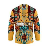Cream hockey jersey back with large "YOUR TEXT" and Native dreamcatcher beadwork