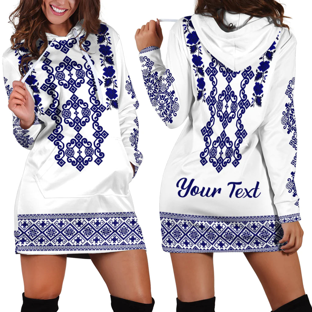 Hoodie dress with white fabric, navy-blue folk embroidery and printed front text, long sleeves