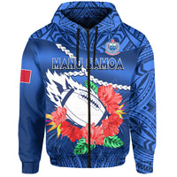 Blue zip hoodie with patterned sides, crest on chest, and red sleeve flag patch