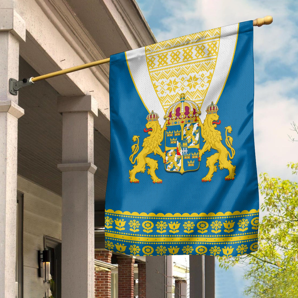 Swedish flag with coat of arms, blue background and gold trim, hanging on pole