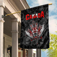 Black house flag on pole: red CANADA text, roaring wolf and maple leaf