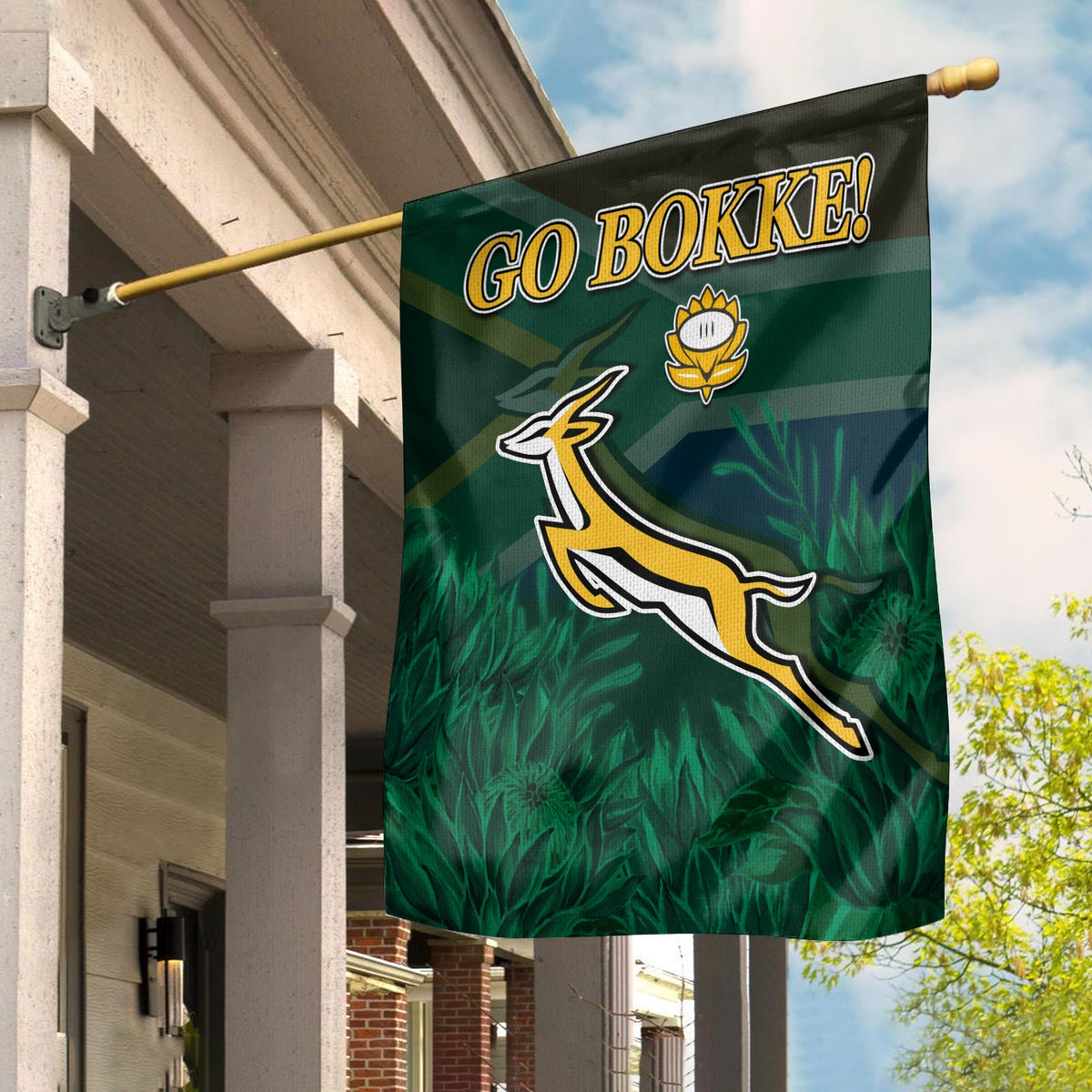 South Africa rugby garden flag with Go Bokke text and Bokke emblem, on pole