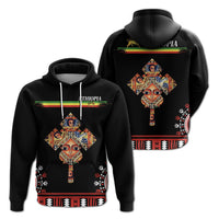 Pullover hoodie: front and back African cross face graphic on black, colorful trim
