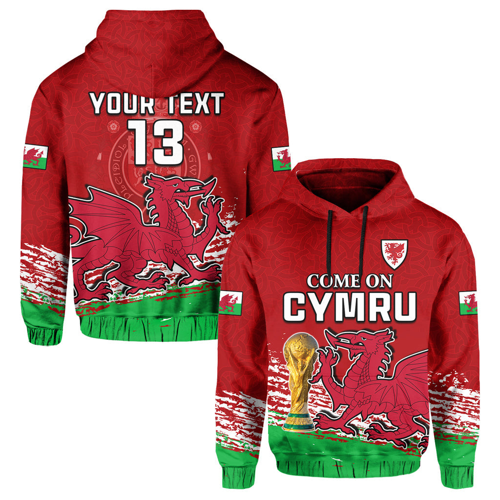 Red Wales fan hoodie with dragon, trophy graphic, and green hem stripes.