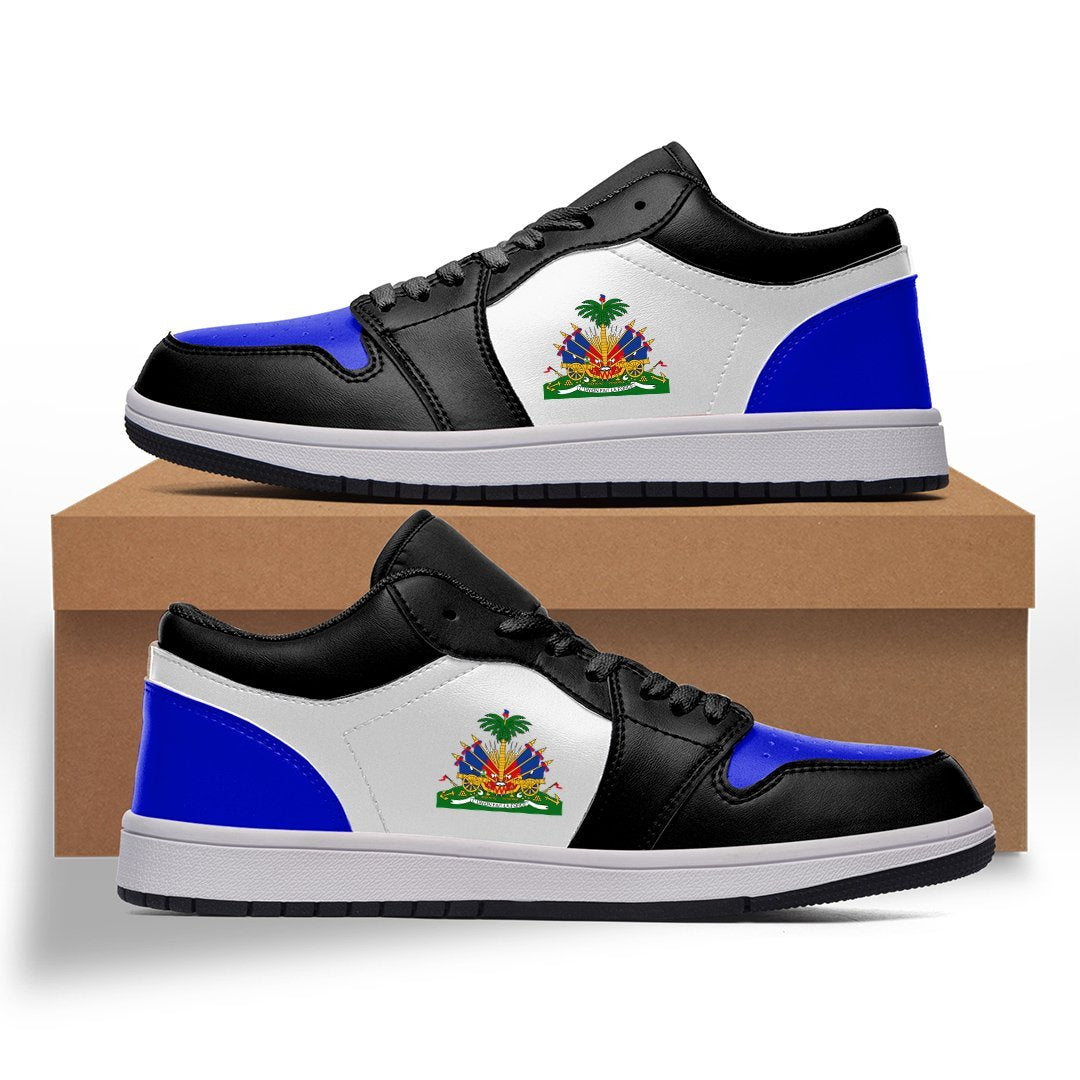 Low-top sneakers with black upper, white center panel, blue side panels and Haitian flag emblem