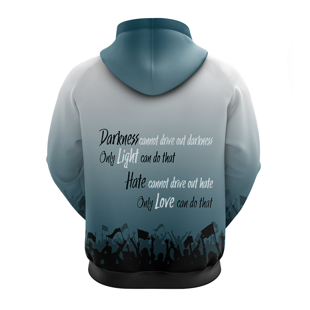 Hoodie back, light teal with dark text graphic and crowd silhouette at hem.