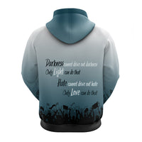 Hoodie back, light teal with dark text graphic and crowd silhouette at hem.