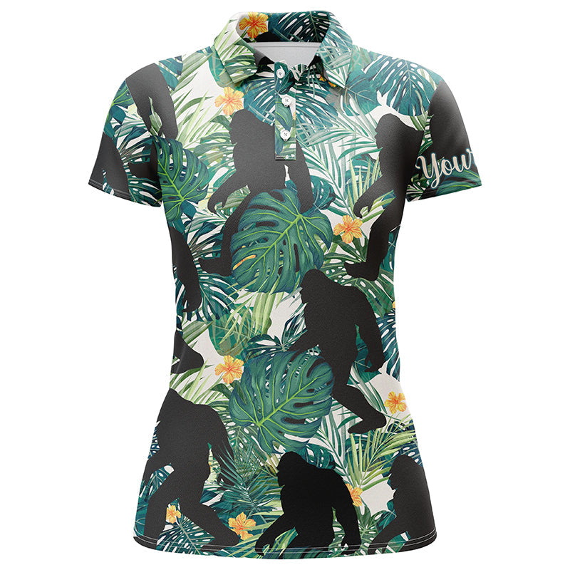 Women’s golf polo shirt with tropical leaf print and black Bigfoot-style graphic, green