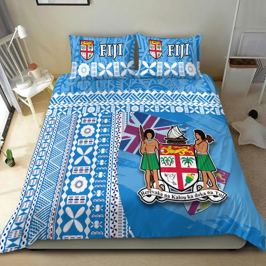Blue Fiji bedding set with geometric stripes, floral motifs, and two matching pillows