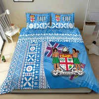 Blue Fiji bedding set with geometric stripes, floral motifs, and two matching pillows