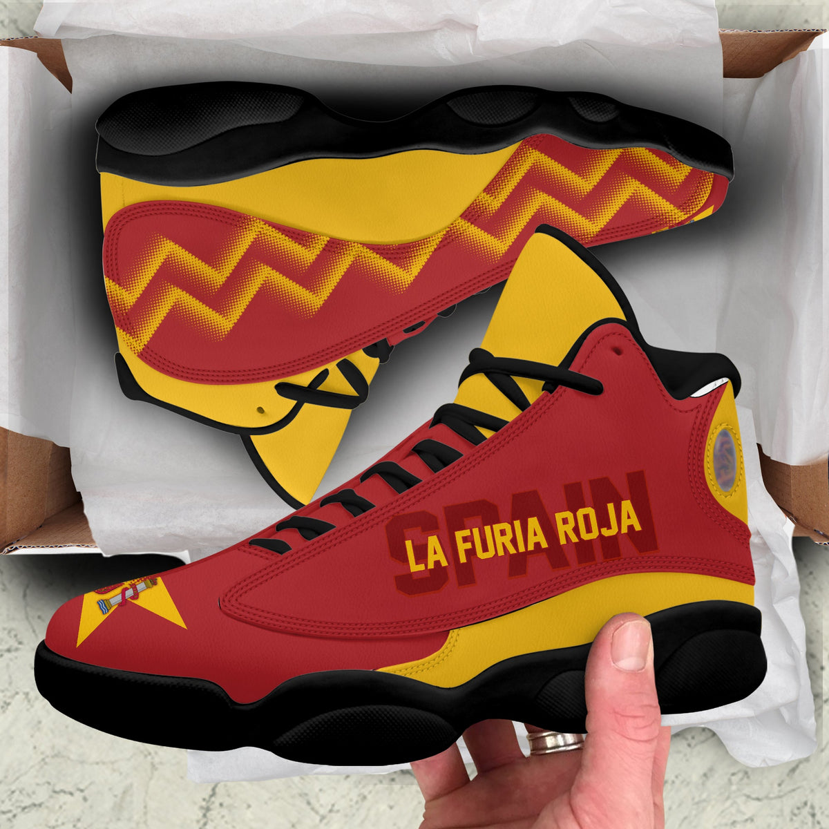 Red and yellow high-top sneakers with zigzag side panel and black sole