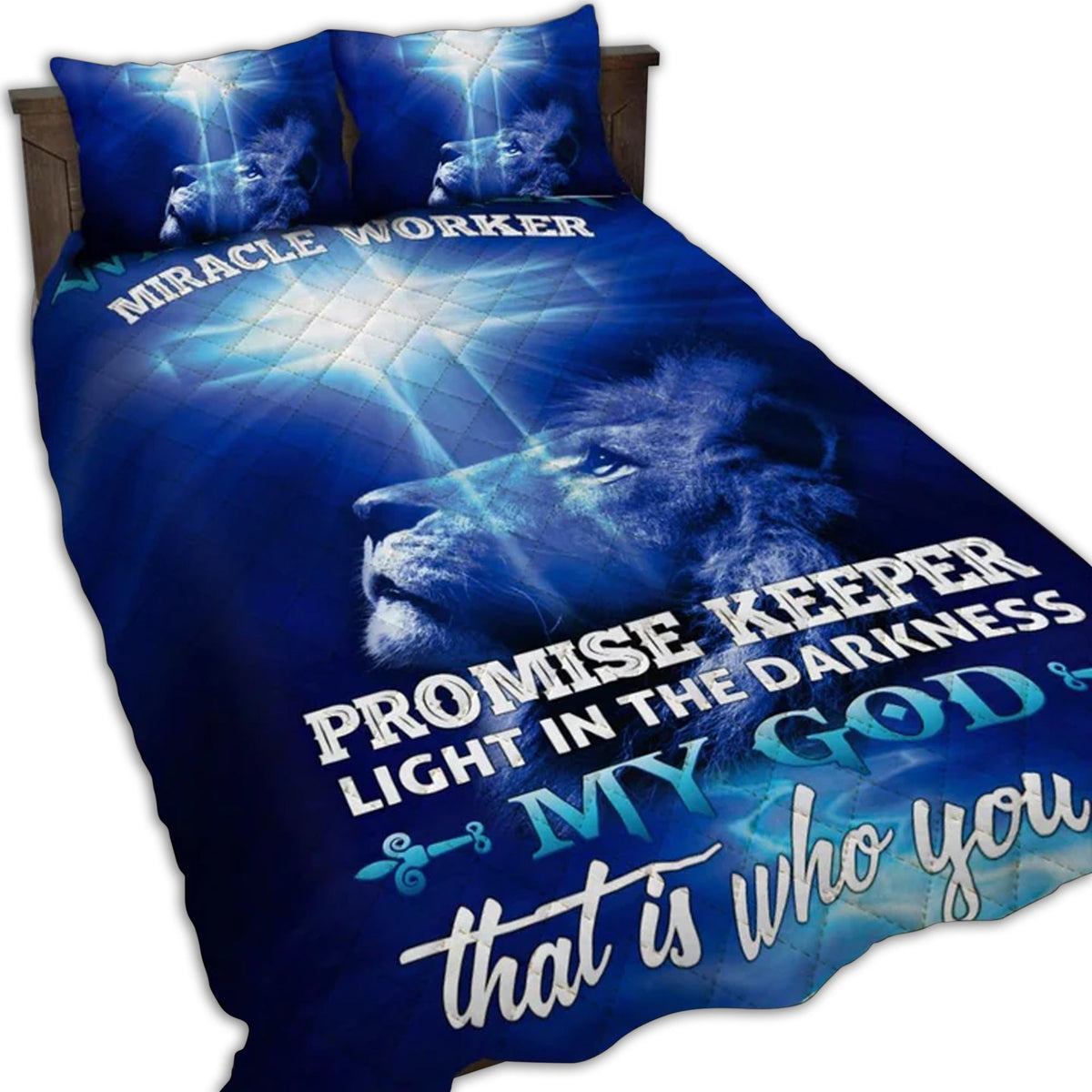 Blue quilt bed set with lion graphic and faith text on comforter and pillows.