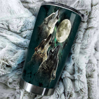 20oz tumbler close-up: wolves and moon graphic on dark teal, silver rim and lid