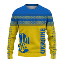 Yellow knitted sweatshirt with blue folk border, trident graphic, and vertical blue lettering