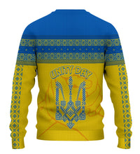 Yellow knitted sweatshirt with blue folk stripes, and 'Unity Day' back print