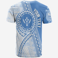 Cerulean T-shirt back with circular Kosrae emblem and large geometric print