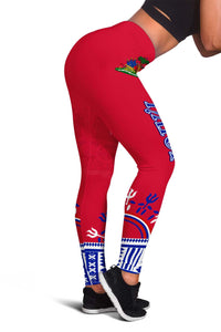 Red dashiki leggings close-up with blue ankle border and colorful center motif