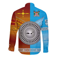 Hawaiian long-sleeve button shirt with multicolor tapa-style pattern and central emblem