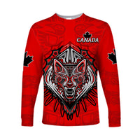 Red long sleeve T-shirt with Canada text, Haida wolf graphic, maple leaf sleeve accents