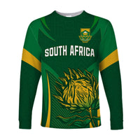 Green long-sleeve rugby shirt with South Africa text, crest, and springbok graphic