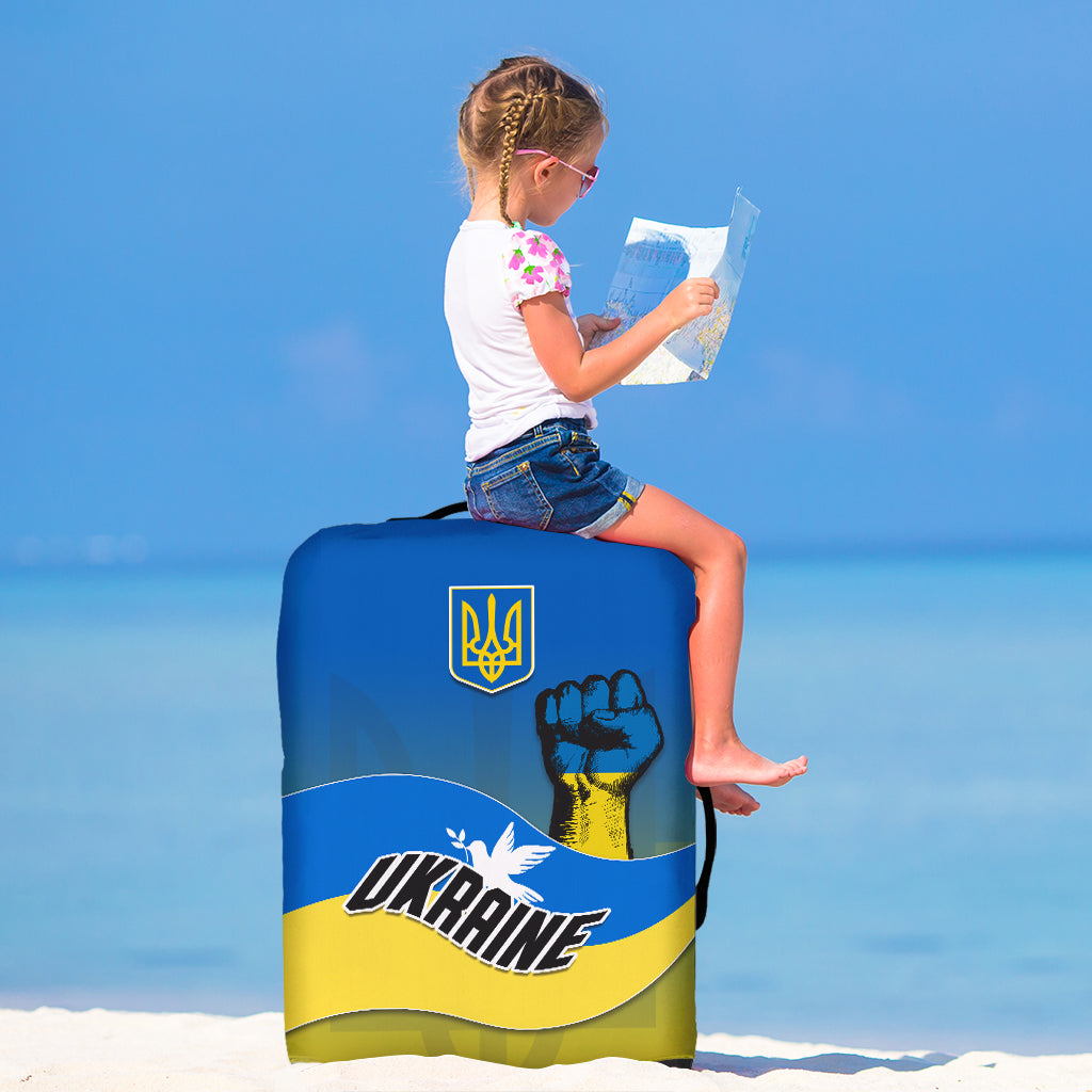 Ukrainian flag luggage cover with trident logo and "UKRAINE" text, fitted over suitcase