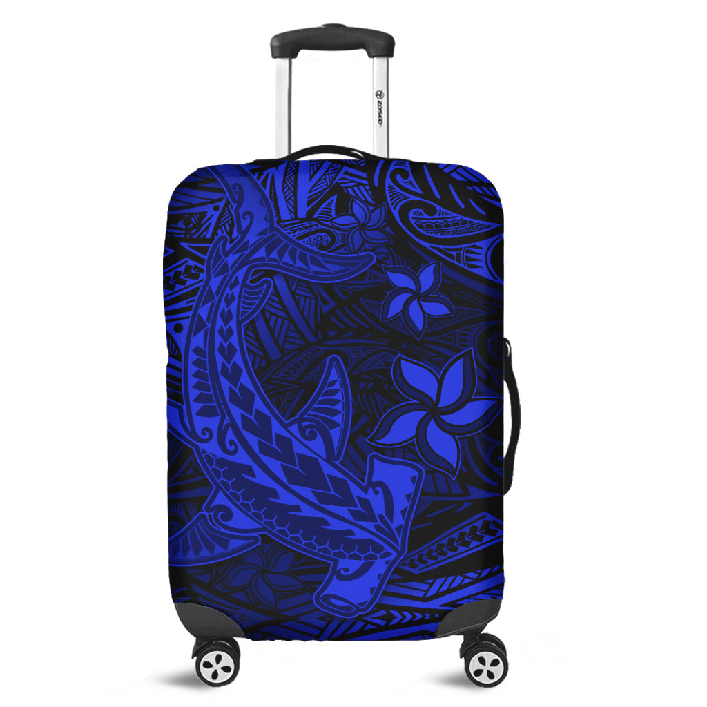Blue patterned luggage cover with Polynesian tribal design, fitted over suitcase
