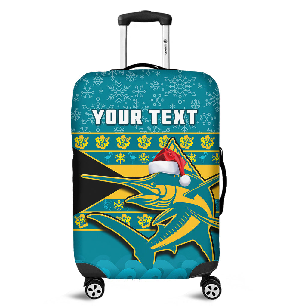 Teal luggage cover with marlin graphic, snowflakes, and Santa hat; custom text area