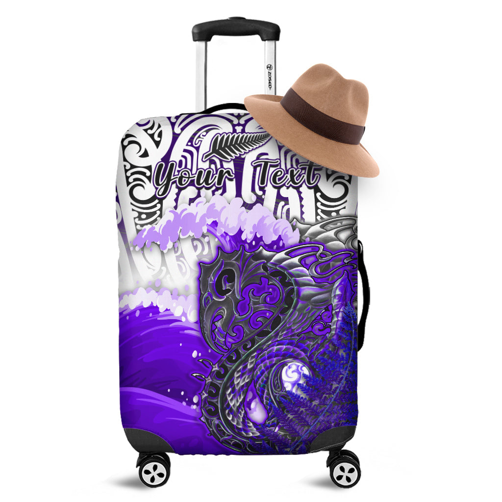 Purple luggage cover with black tribal patterns and koi fish design over suitcase