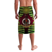Red lavalava sarong with green/yellow geometric borders and central sunburst emblem (back)