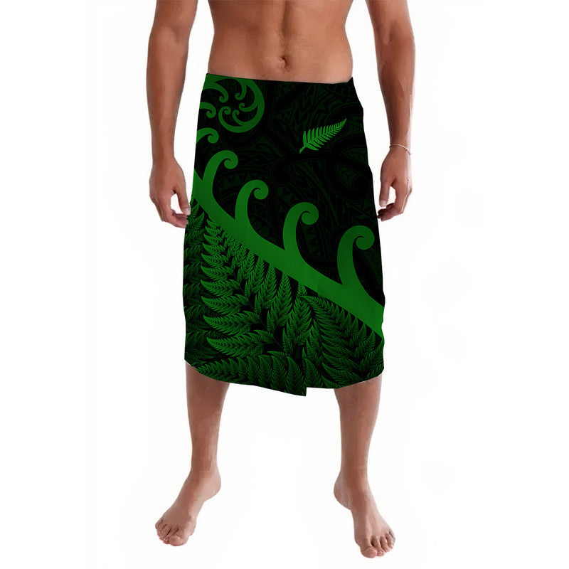 Green and black patterned lavalava with fern and koru motifs