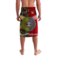 Colorful lavalava sarong featuring circular animal graphic, red panel, and geometric borders