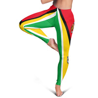 Guyana flag leggings side stretch pose with green center stripe and yellow sides